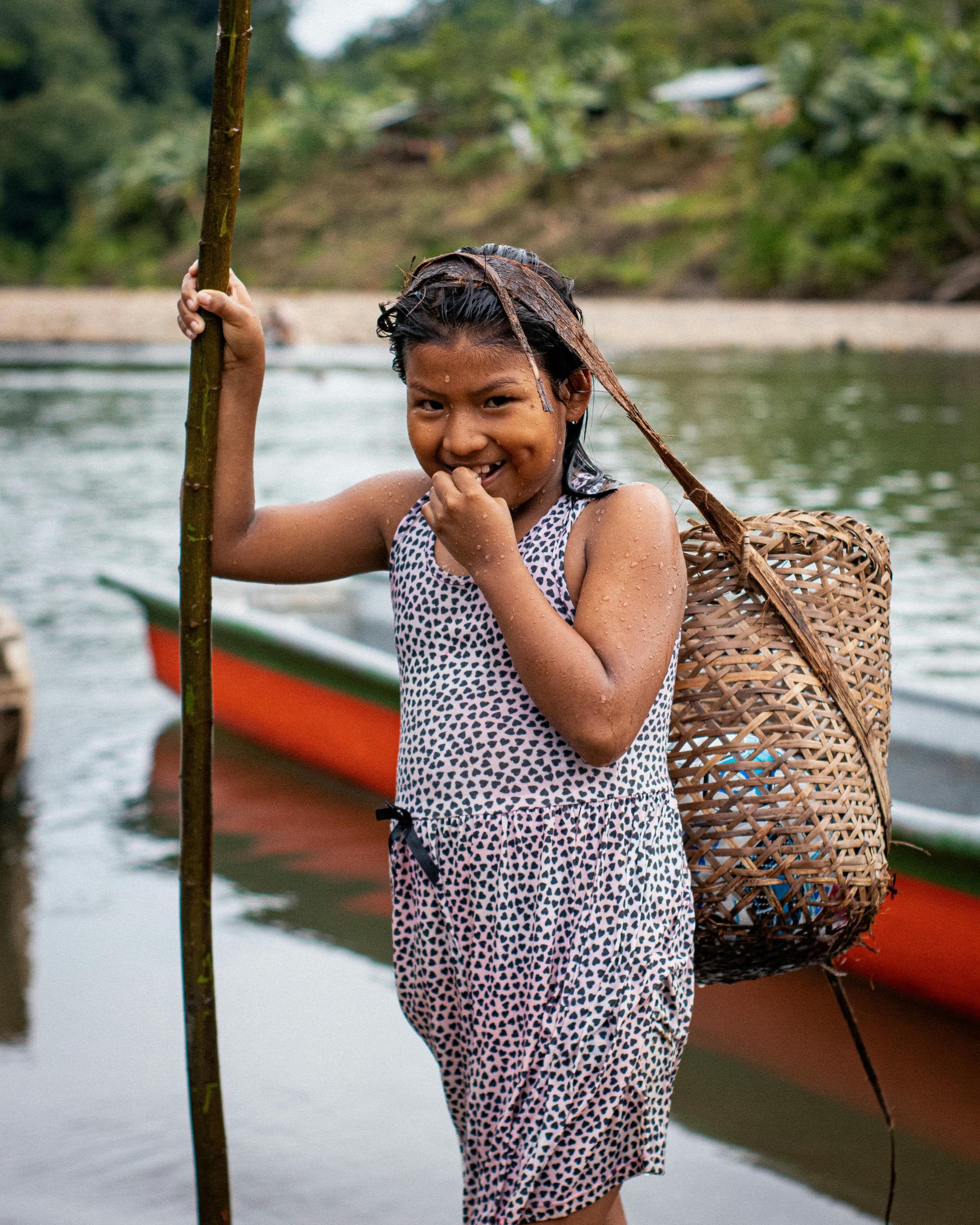 A girl with a woven basket on her back.